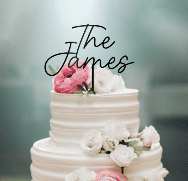 A wedding cake with the name of the couple on top.